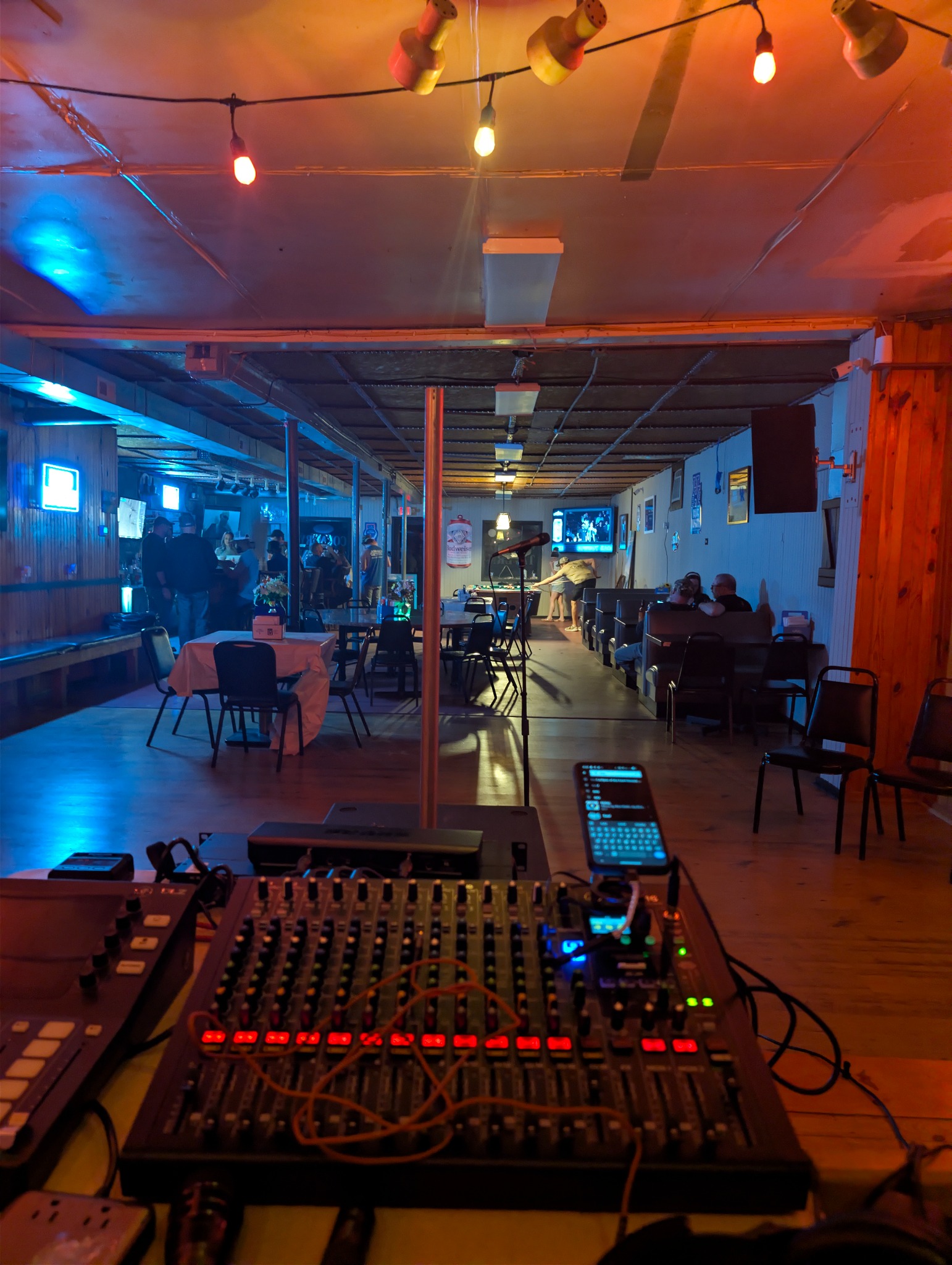 DJ Fiddlesticks mixer, laptop, and lighting control station